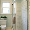 Photo of bathroom with white tile and blue walls by pink_cotton_candy/istockphoto.com.