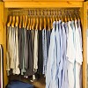Clothing grouped by type and color. Photo of an orderly closet by vandervelden/istockphoto.com.