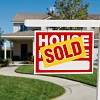 Photo of a house with a sold sign by Feverpitched/istockphoto.com.