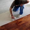 Flooring installation by Carlos/Wikimedia Creative Commons