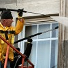 Hire a pro rather than power washing from a ladder.