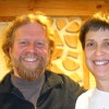 Todd Muller and Patty Smythe in front of a cordwood wall.  Photo: Cris Carl.