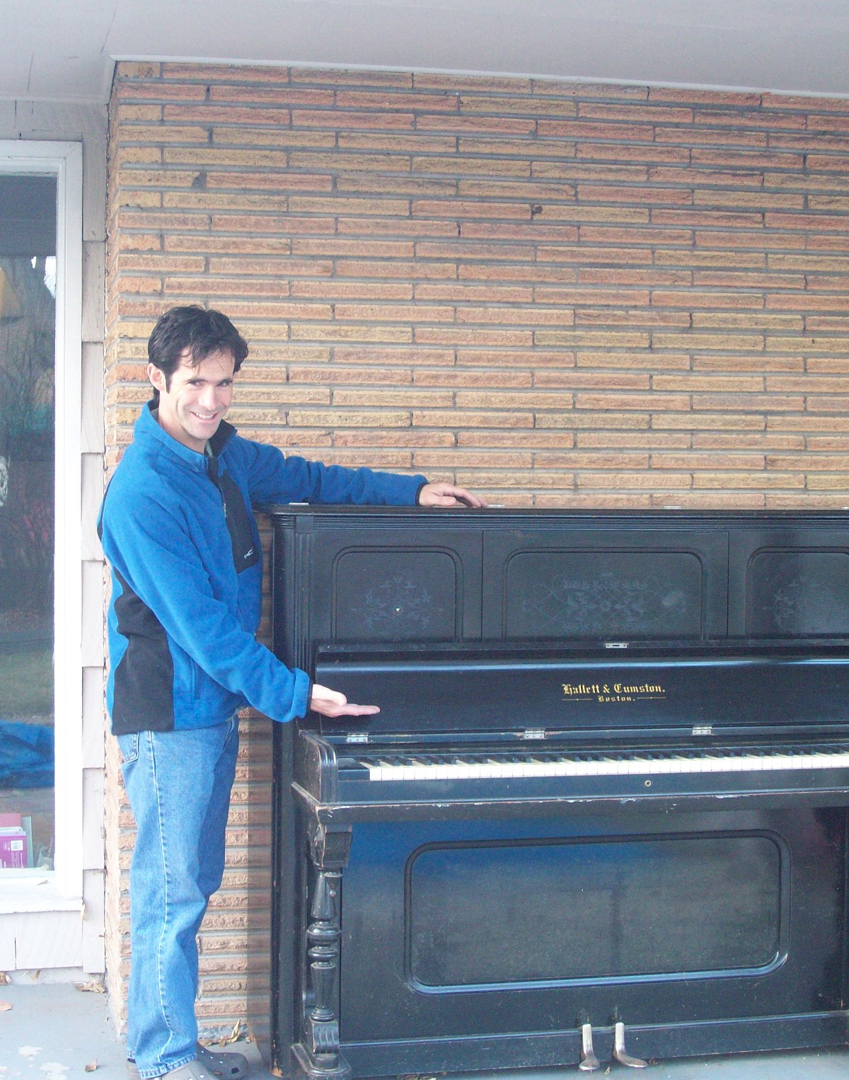 This is the author, with the piano that he is now storing on his back porch.