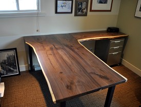 A custom native edge wood desk by the author. 