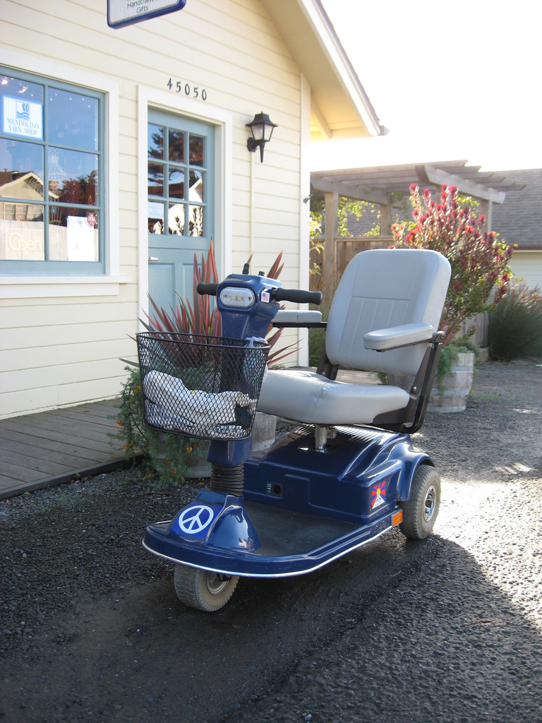 The scooter had to be parked outside because the building does not have a ramp. (Photo by s.e. smith)