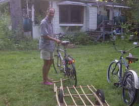 Gabor Lukacs with his DIY bamboo bike trailer. Photo by Cris Carl.