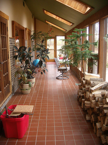 Turning a screened in porch into a solarium adds usable square footage to a house. (Photo: espring4224/Flickr)