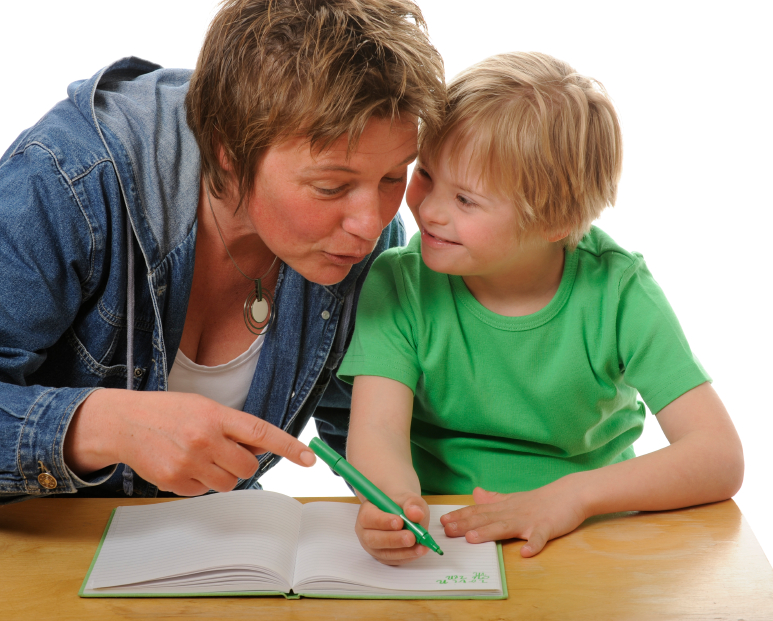 A mom helps a child with Down's Syndrome with homework. (Photo: EVAfotografie/ istockphoto.com)