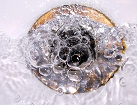 Photo of a drain and bubbles by gugacurado/sxc.hu.