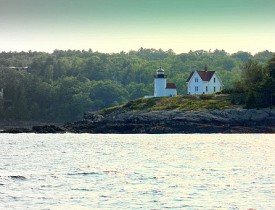 Photo of a house and lighthouse on Penobscot Bay by Librarygroover/Flickr.