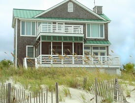 Photo of a beach house with a screened in porch by lightbulbf/sxc.hu.