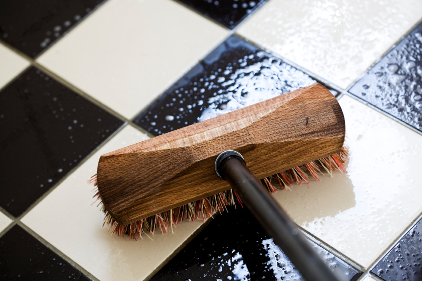 Photo of scrubbing a tile floor by eyewave/istockphoto.com.