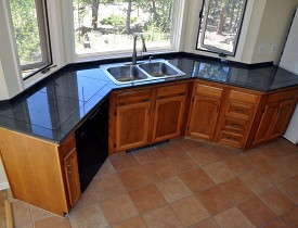 Granite tile counter top and photo by KMS Woodworks.