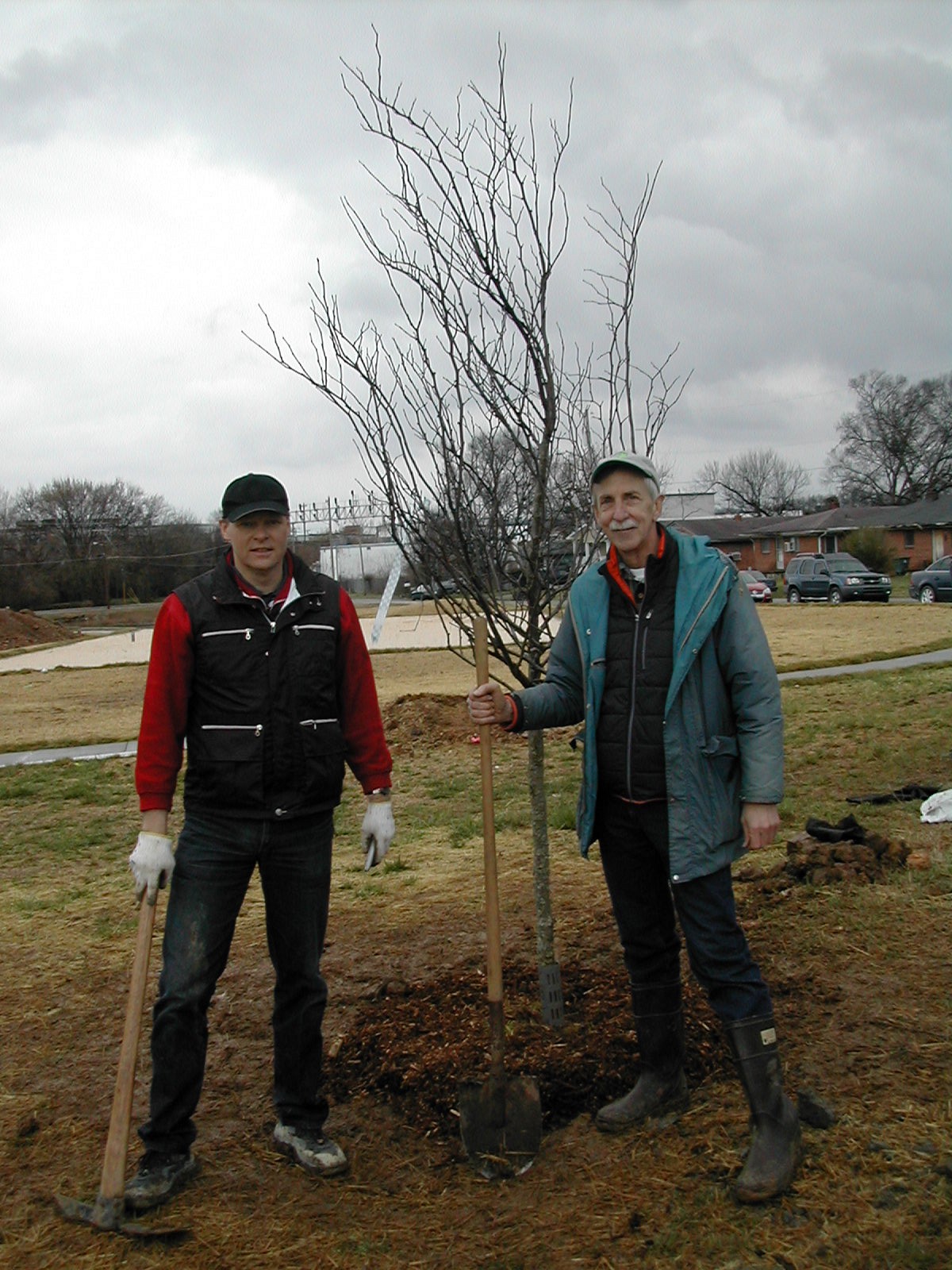 Gene Hyde, planting a tree with the CEO of the Volkswagen plant in Chattanooga.