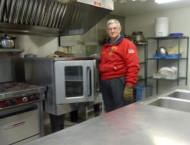 Dick Henry in the Guiding Star Grange's new kitchen. Photo by Cris Carl.