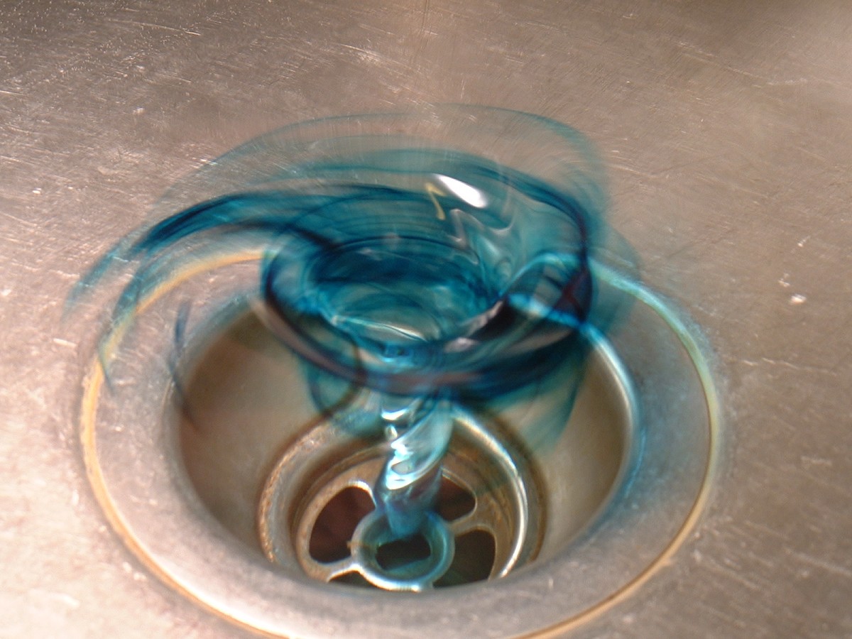 Porcelain tub stained all over by gases from drain cleaner