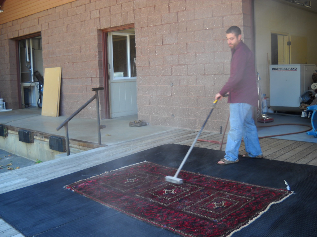 Cleary dusting the carpet.  Photo: Cris Carl