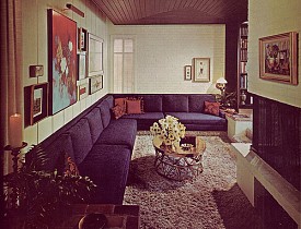 A cool retro living room with painted brick walls and a painted brick fireplace surround. Photo: army.arch/Flickr Creative Commons
