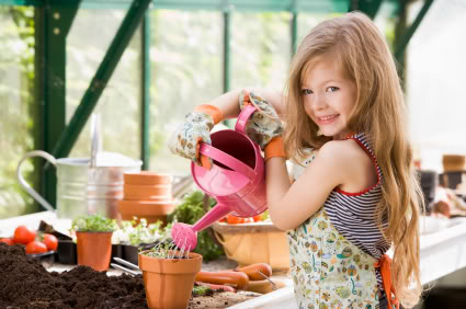 Girl in backyard greenhouse