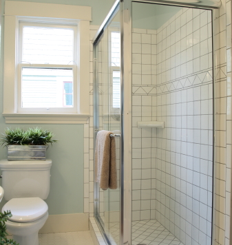 Photo of bathroom with white tile and blue walls by pink_cotton_candy/istockphoto.com.