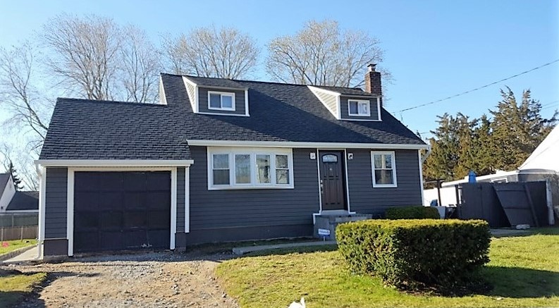 House looks great with new roof and siding