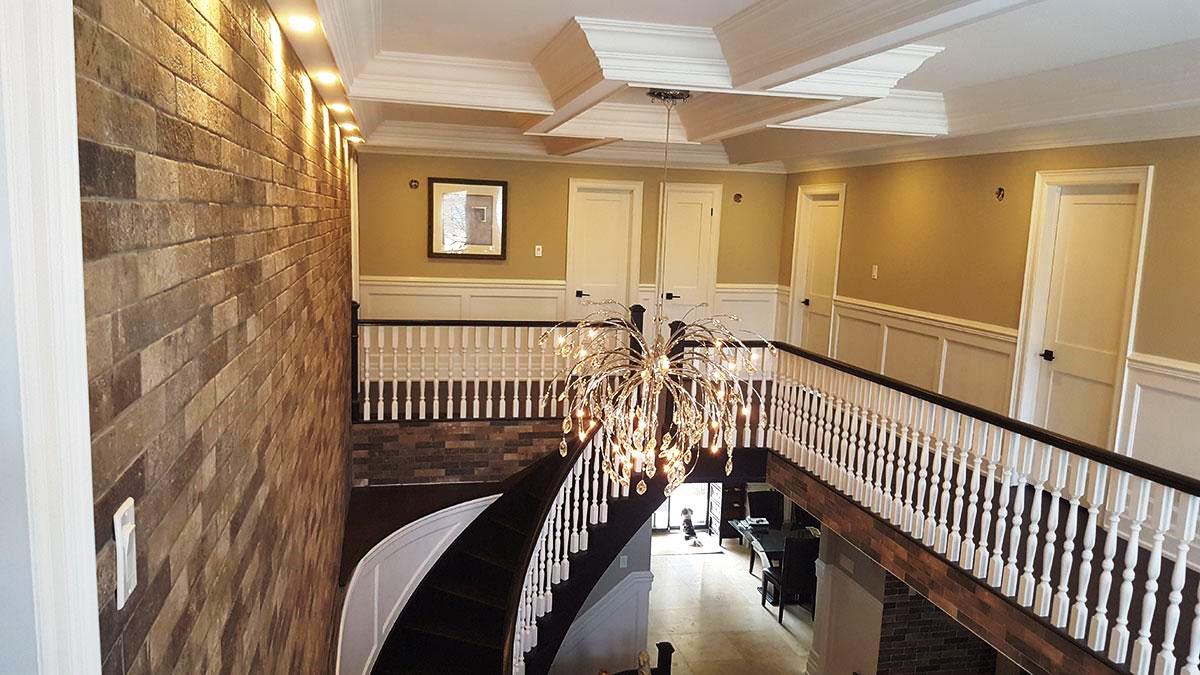 Coffered ceiling crowns a staircase by ceilingstucco/morgueFile