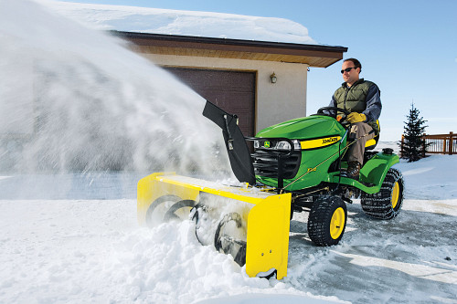 Lawn tractor blowing snow/courtesy of John Deere