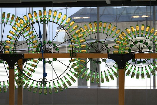 Beer bottle clocks by Stanley Clockworks stand on display at the Philadelphia International Airport. (Photo: waitscm/Flickr)