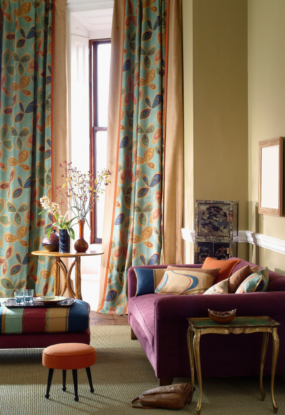 A bright three seater sofa defines this colorful living room space. (Photo: istockphoto.com)