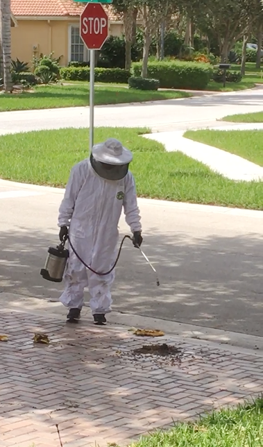 Pest control pro in his astronaut suit