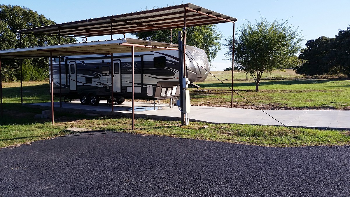 Travel trailer parked on new concrete slab