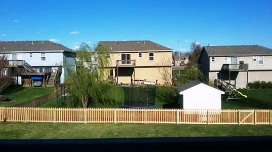 Long view of new wood fence