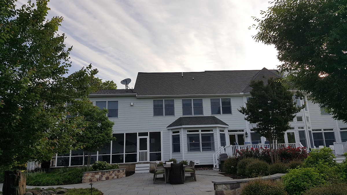 Ridge vent and shingle repair to the right