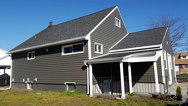 Rear view of replacement roof & siding