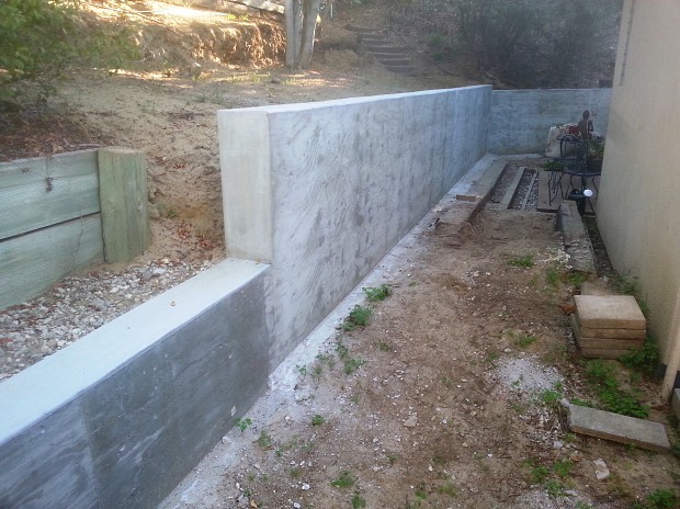 Sturdy concrete wall next to my house