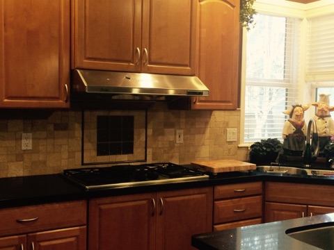 Travertine tile backsplash in the kitchen