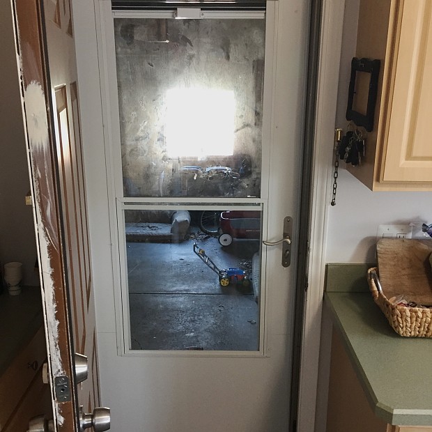 House-to-garage storm door