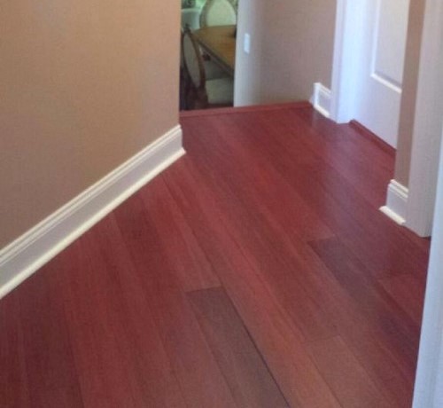 Hardwood floor at head of stairs