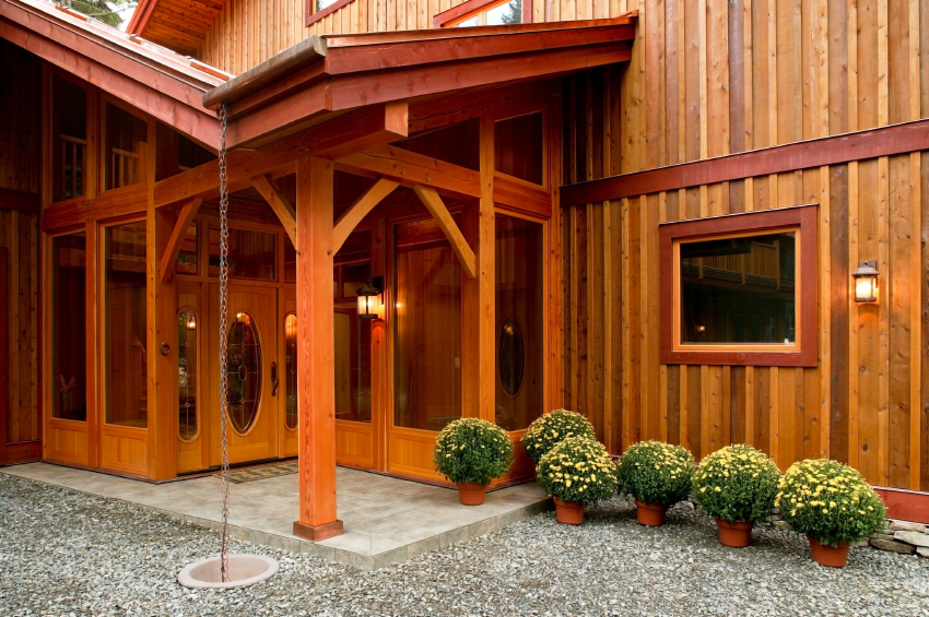 Photo of a house with wood board-and-batten vertical siding by laughingmango/istockphoto.com.